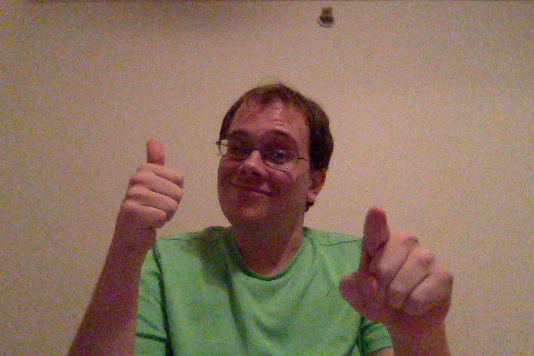 green shirt thumbs up